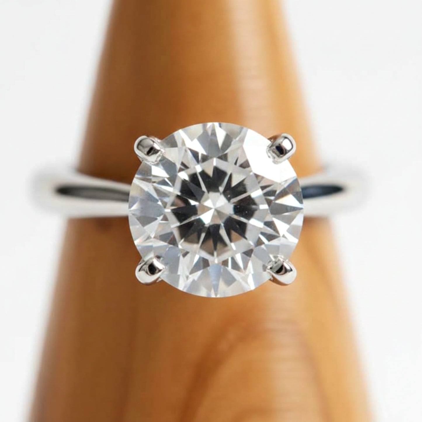 Solid walnut wood ring holder cone for engagement rings.