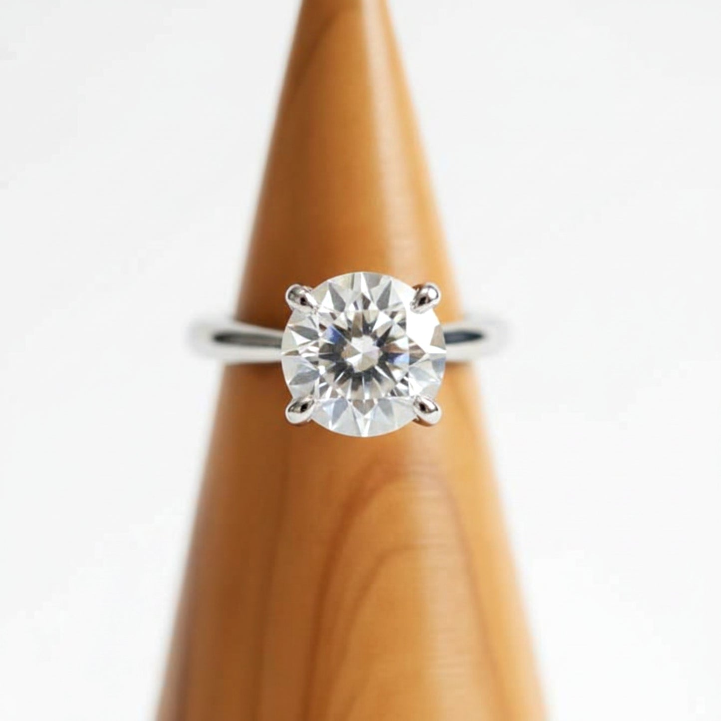 Solid walnut wood ring holder cone for engagement rings.