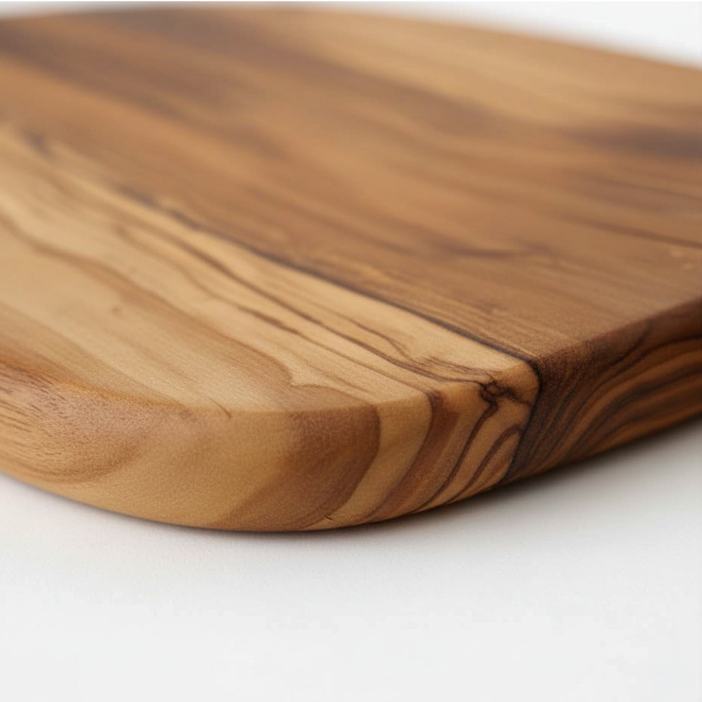 Olive wood serving paddle board for cheese and charcuterie.
