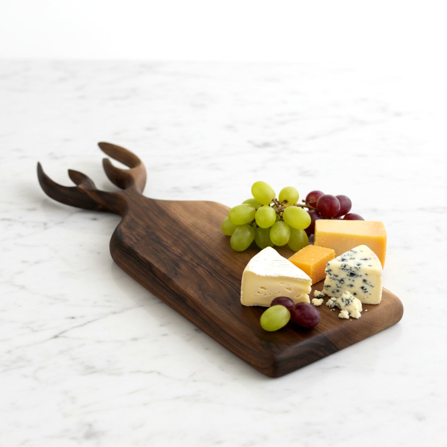 Hand carved walnut wood serving board with antler handle.