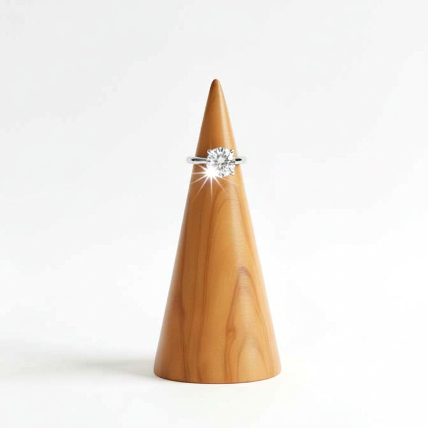 Solid walnut wood ring holder cone for engagement rings.