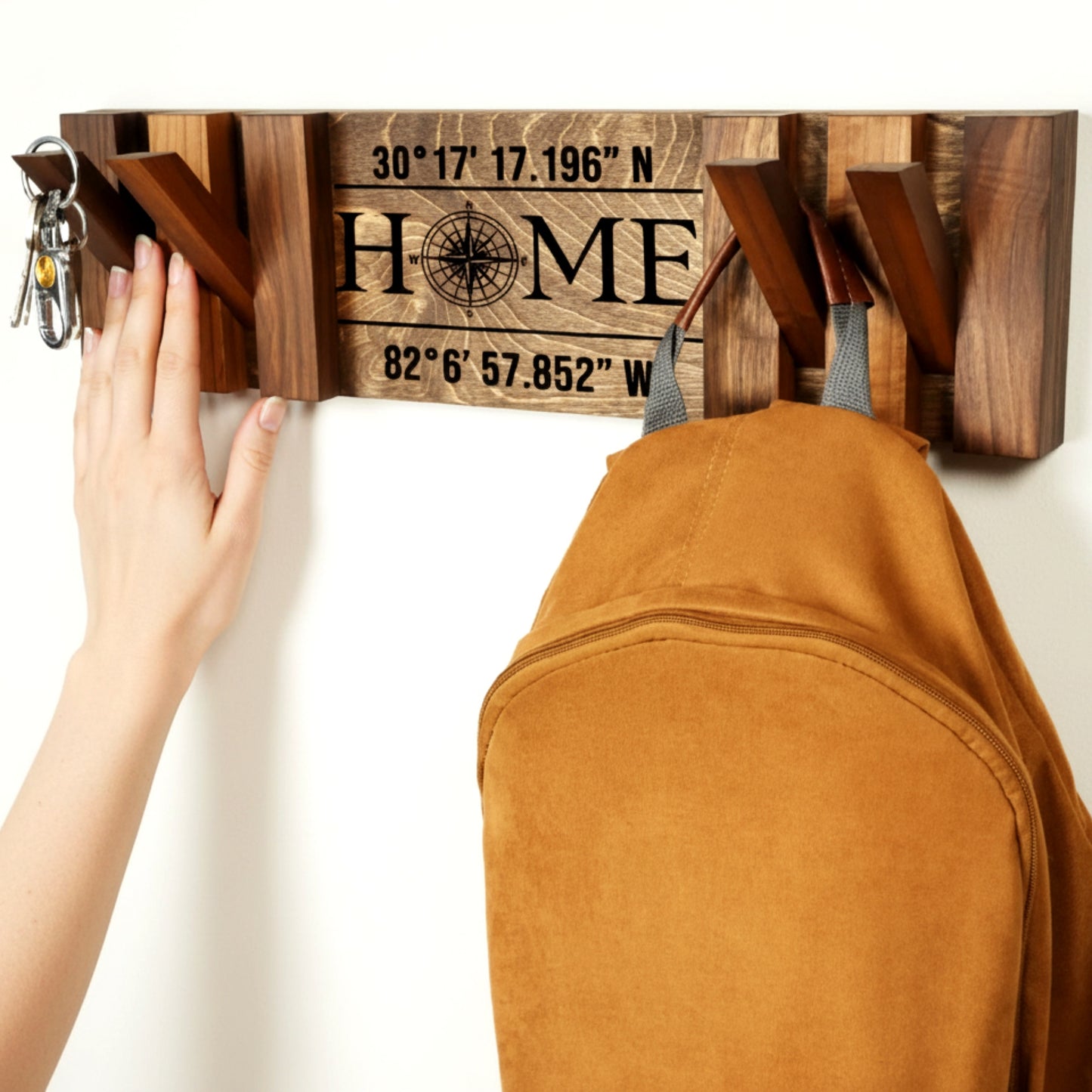 Walnut piano coat rack wall mounted flip down hooks.