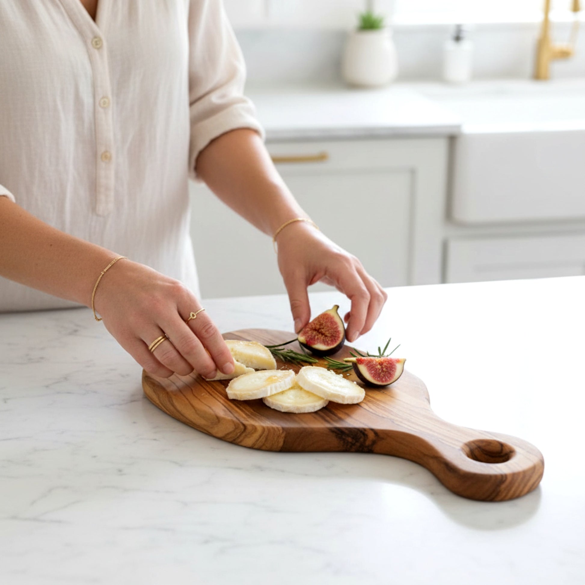 Olive wood serving paddle board for cheese and charcuterie.