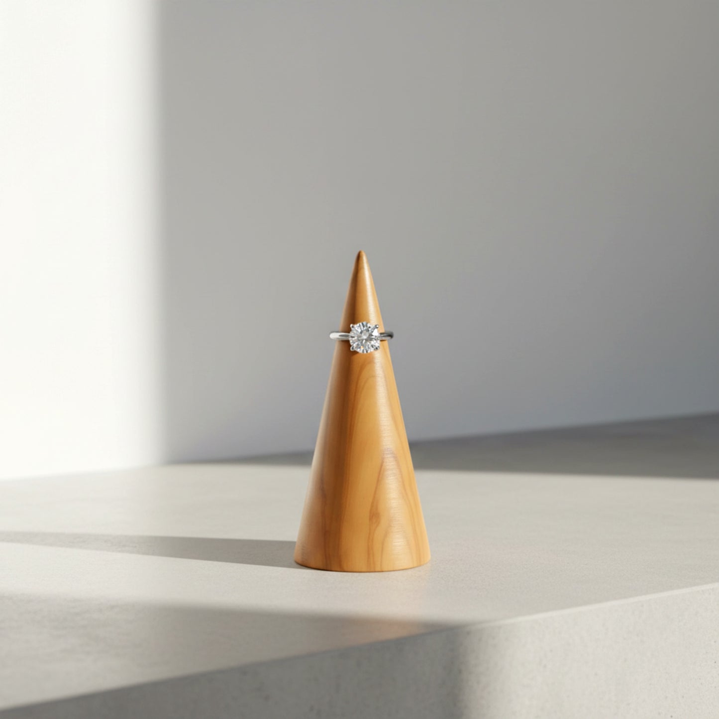Solid walnut wood ring holder cone for engagement rings.